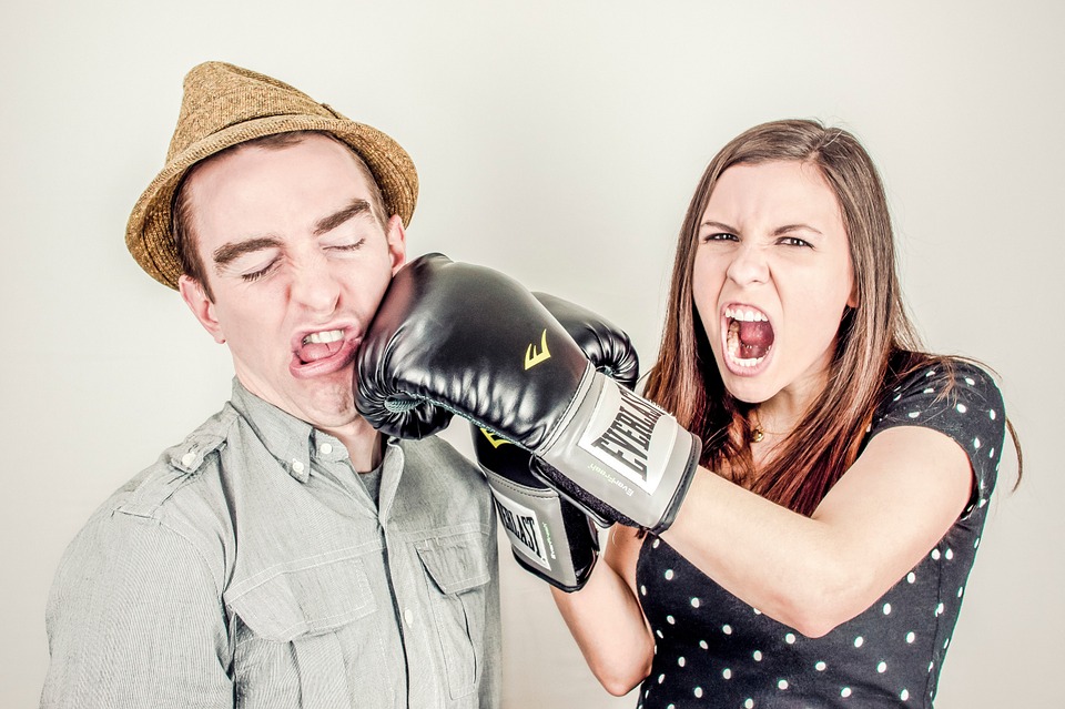 Woman from sales punching man from marketing